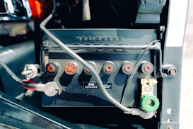 Car battery close-up showing terminals and connections