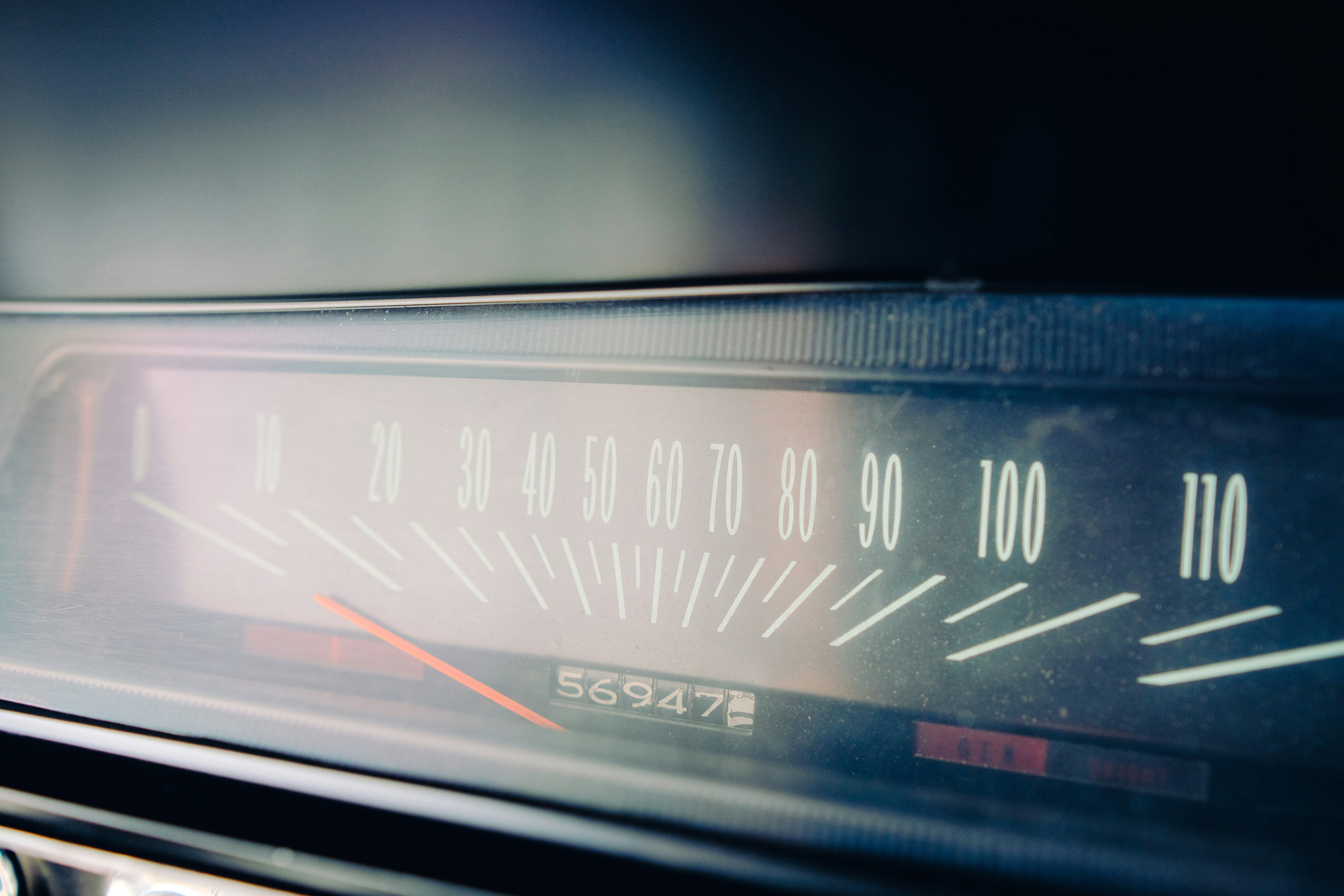 Close-up of a vintage car speedometer.
