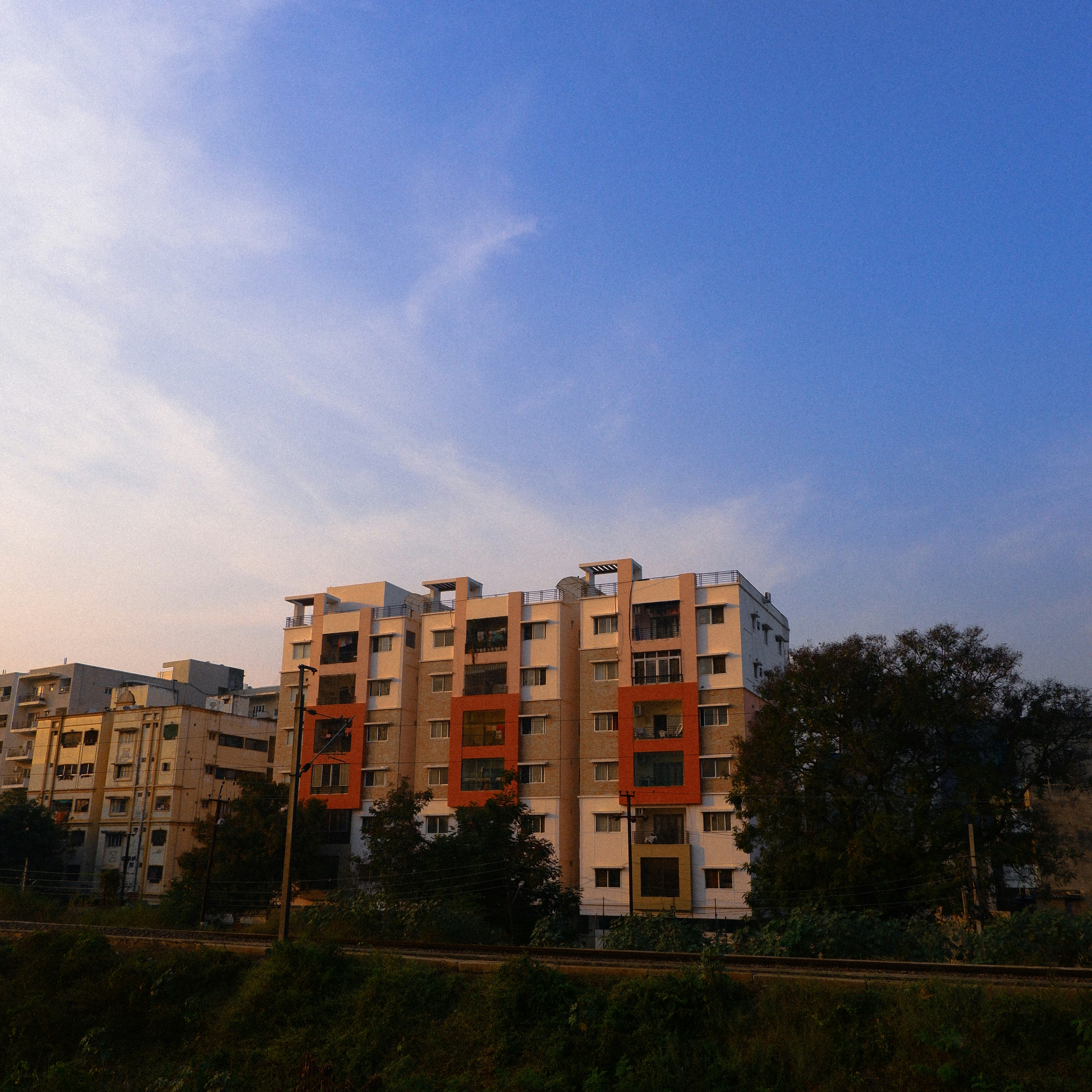 Apartment buildings against a blue sky