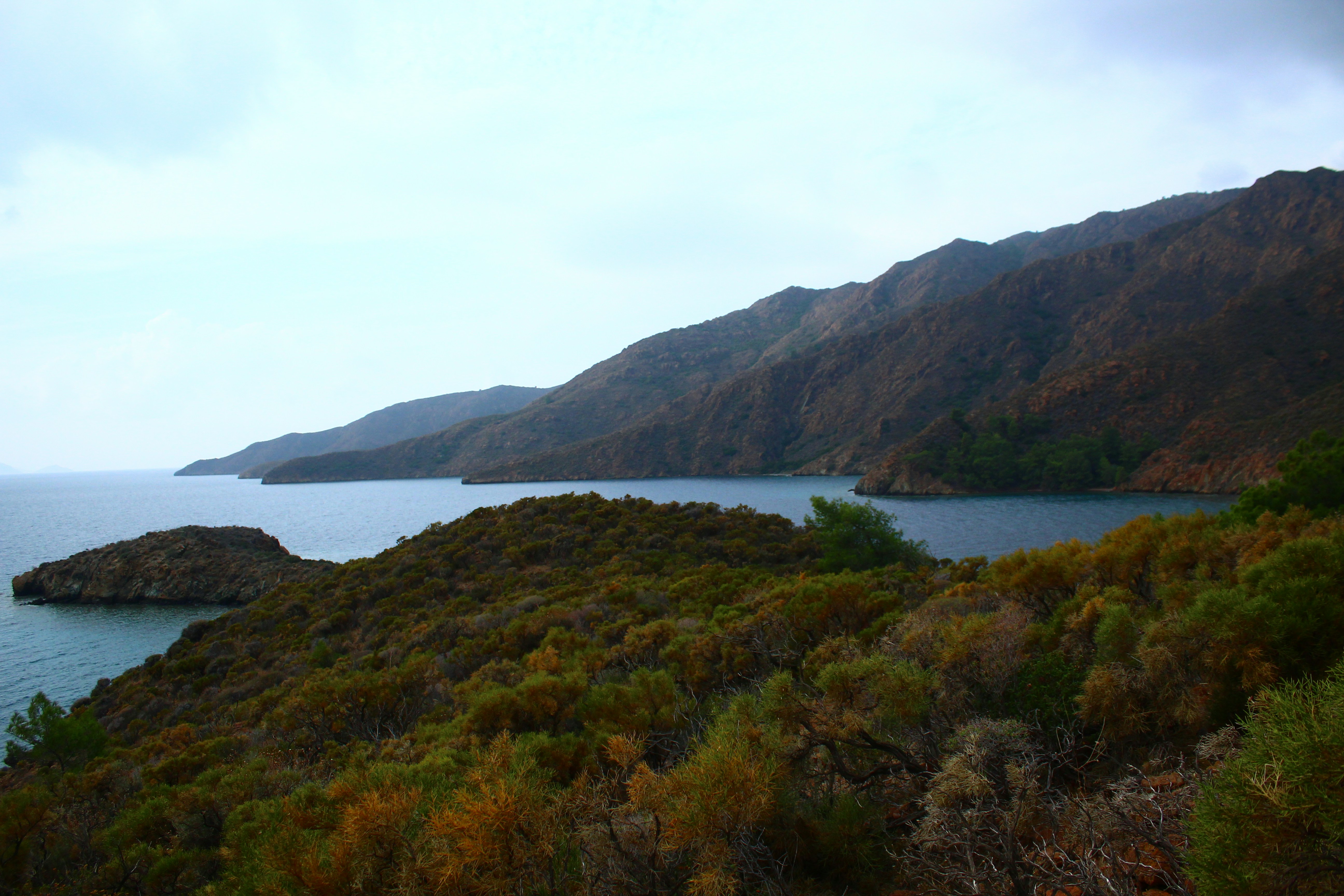 Coastal landscape with rocky hills and calm sea