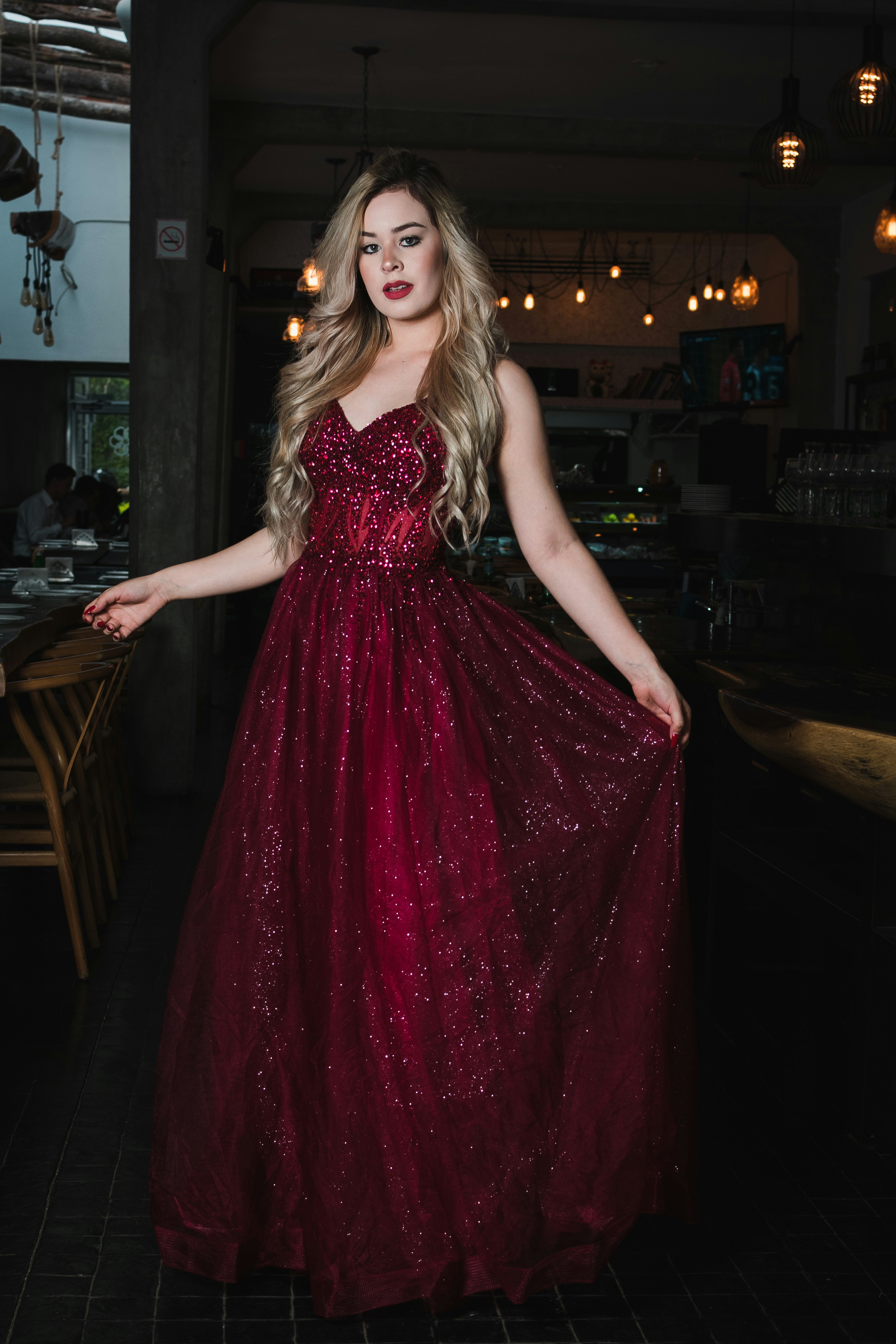 Woman in a sparkling red formal gown
