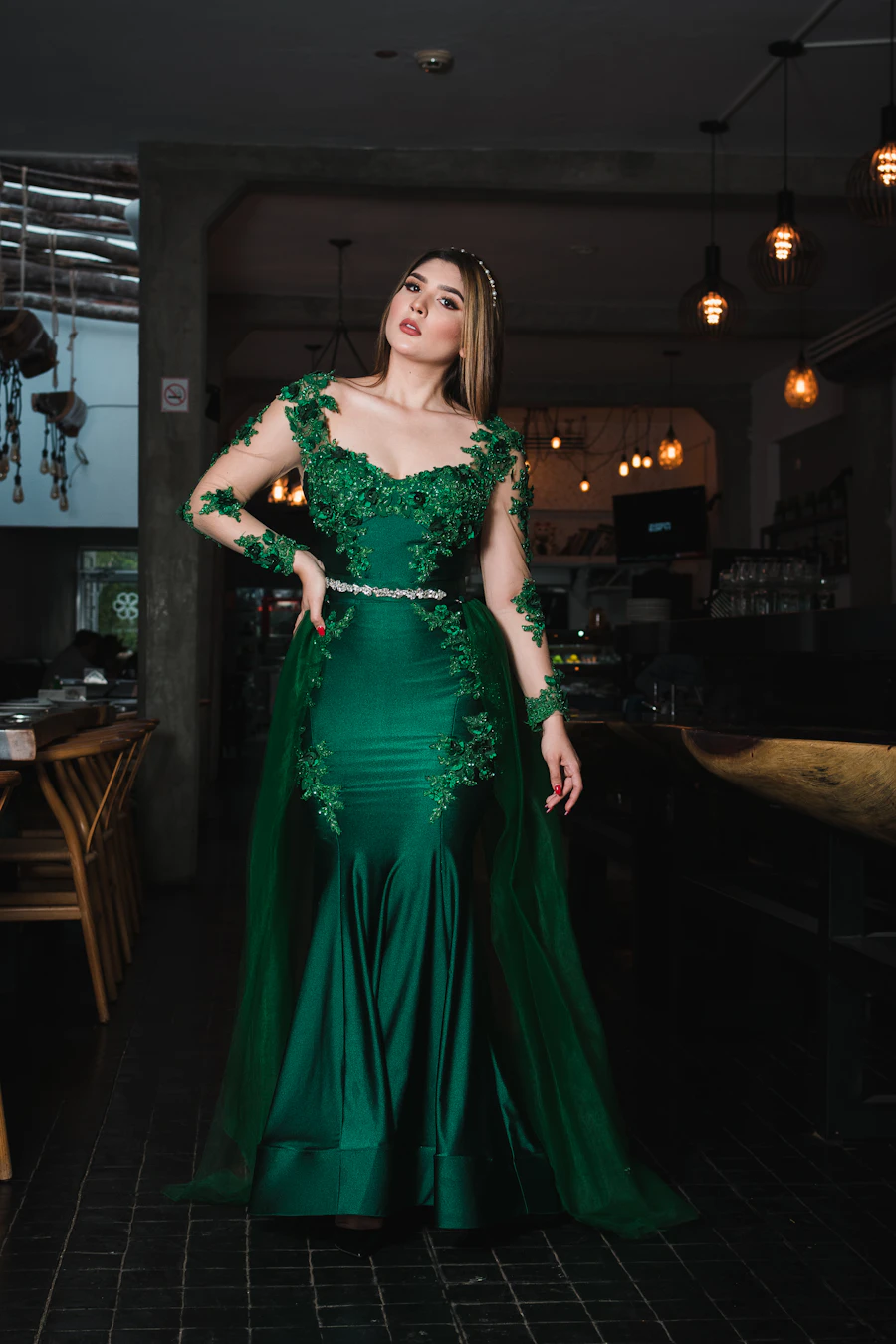 Woman in an elegant green evening dress