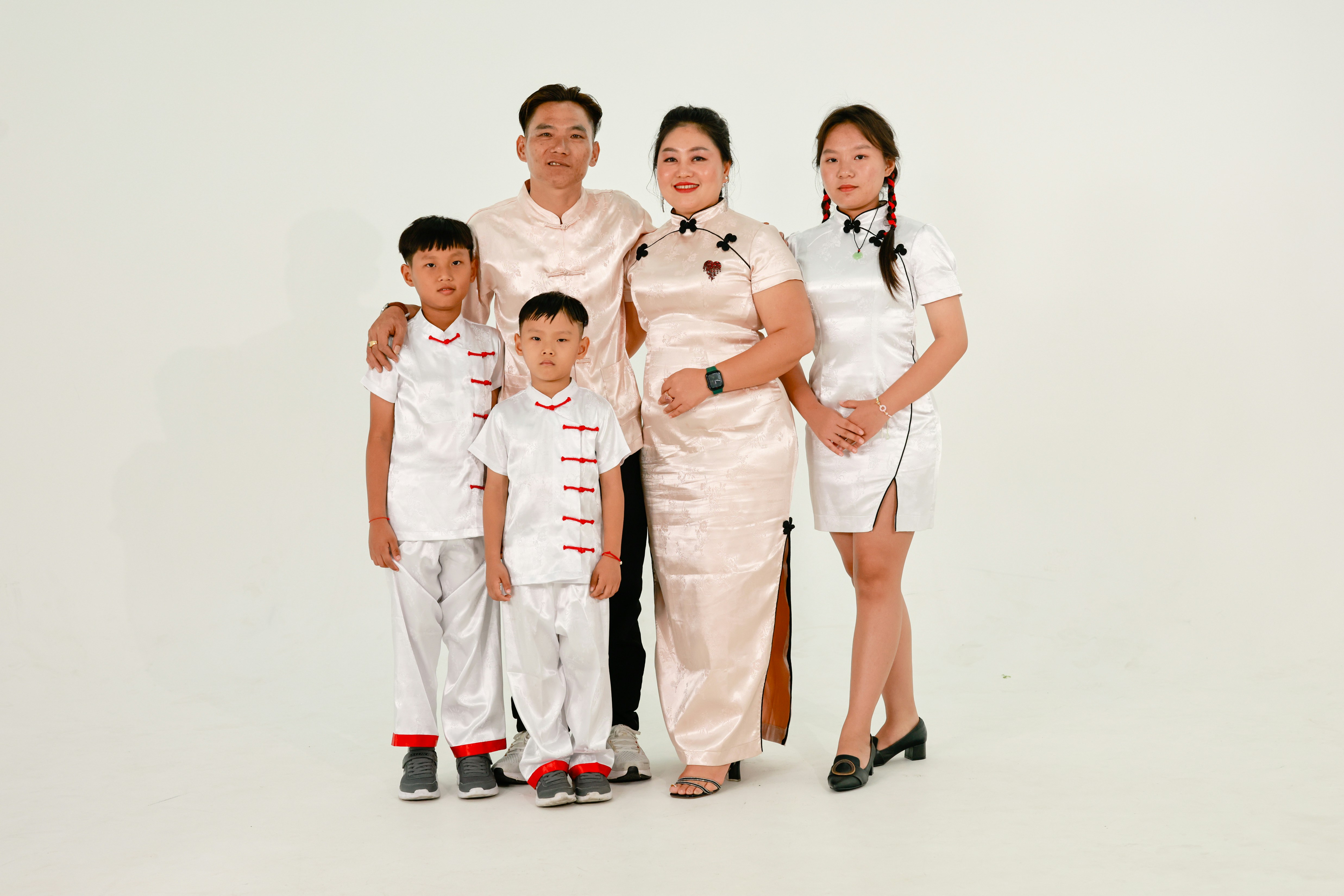 A family of five in traditional chinese clothing
