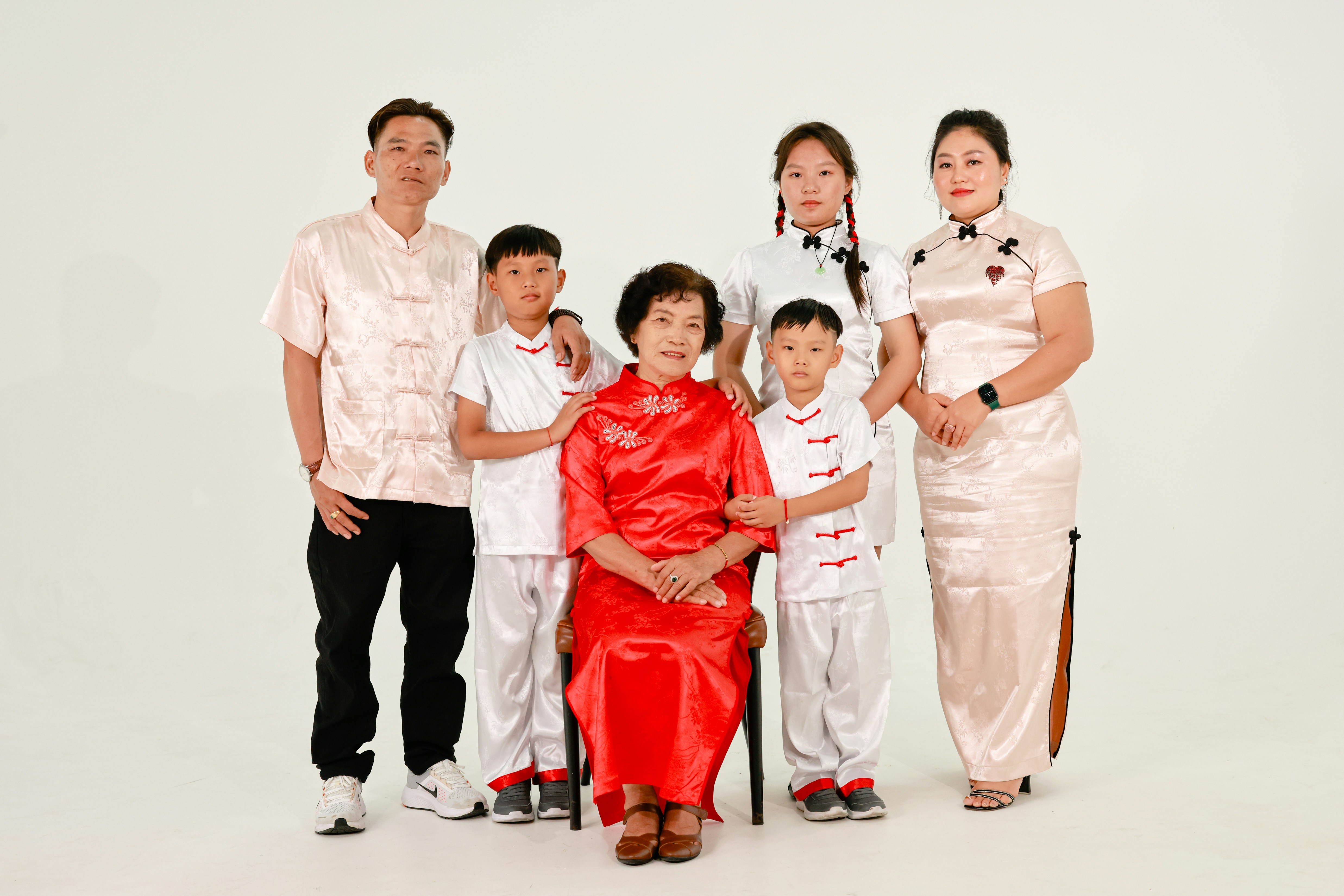 A multi-generational family posing for a formal portrait