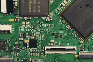 Close-up view of a green circuit board with components.