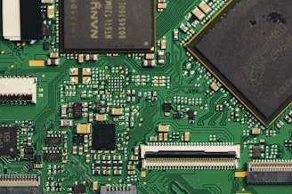 Close-up view of a green circuit board with components.