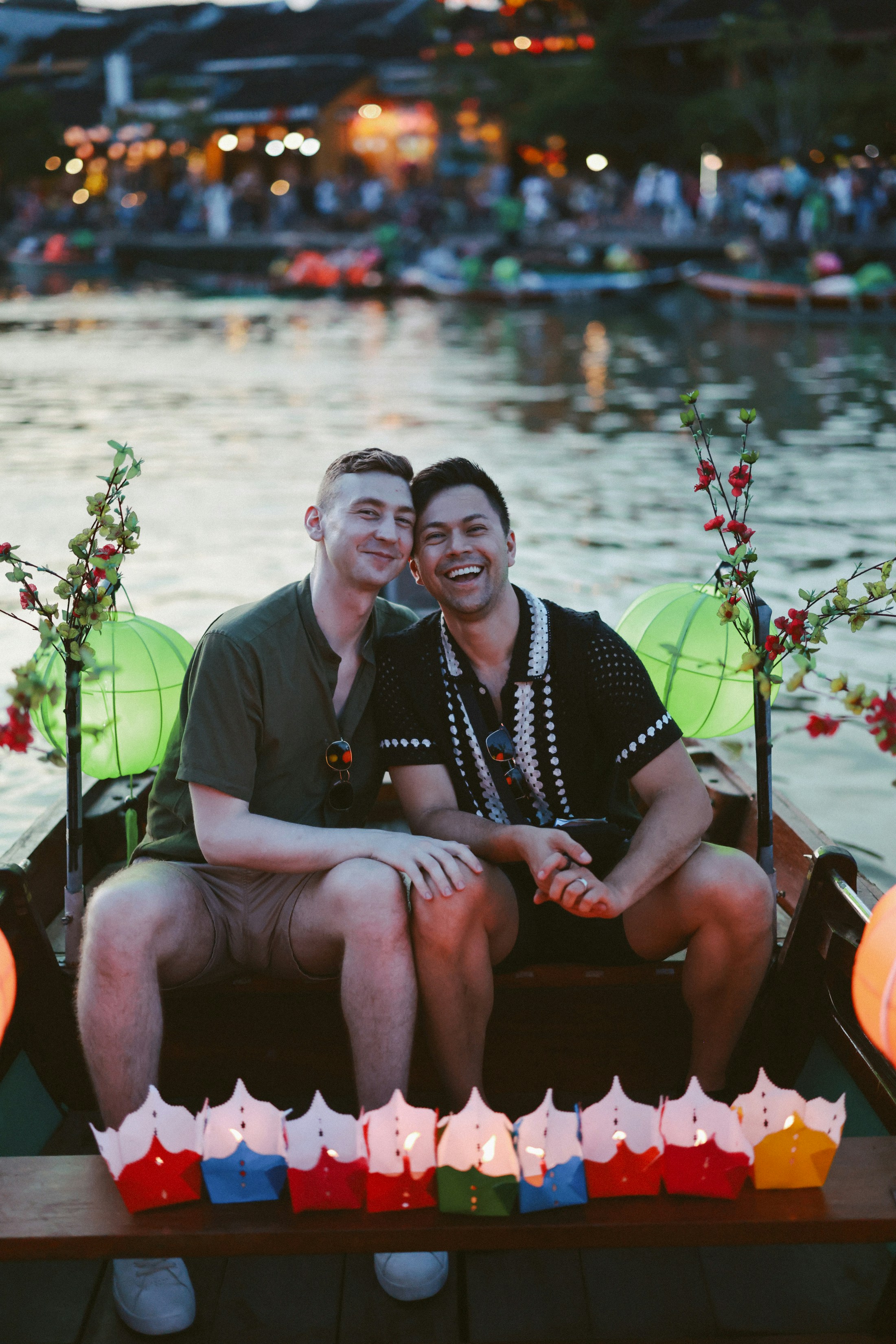 Couple smiling in a boat with lanterns photo – Free Travel Image on ...