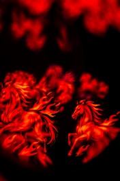 Two horses made of fire running