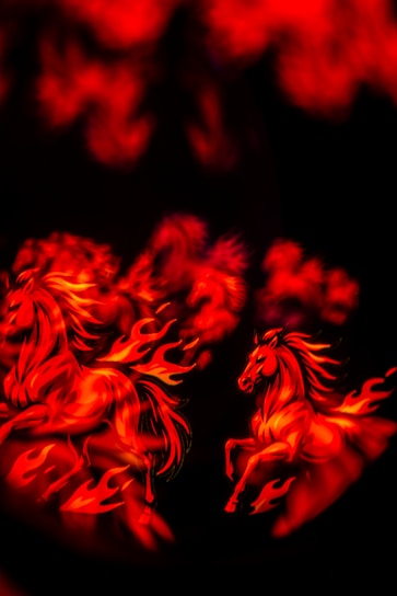 Two horses made of fire running