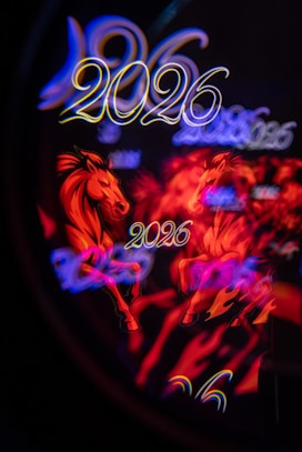 Two horses with 2026 text