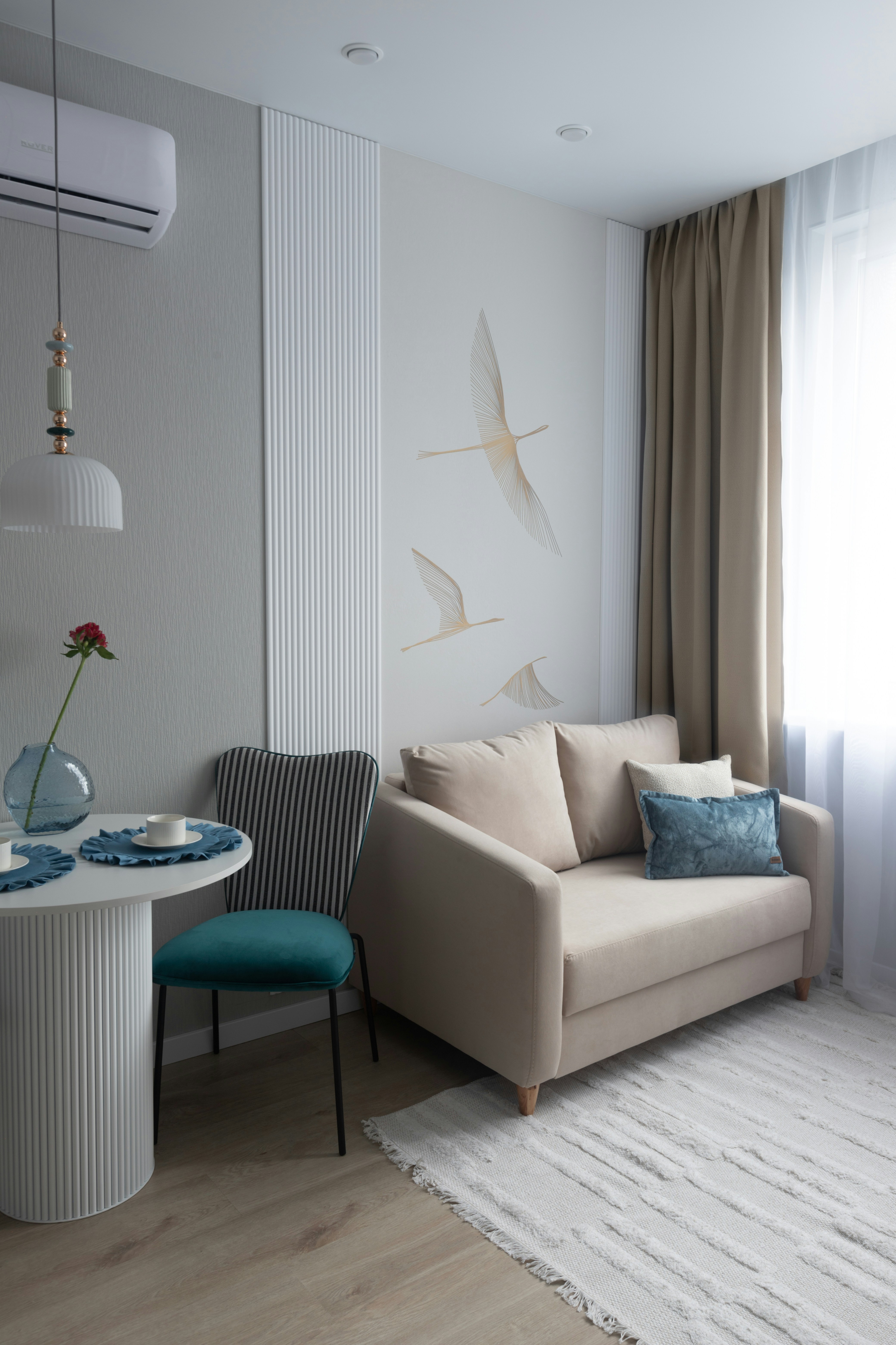 Cozy living area with sofa and dining table.