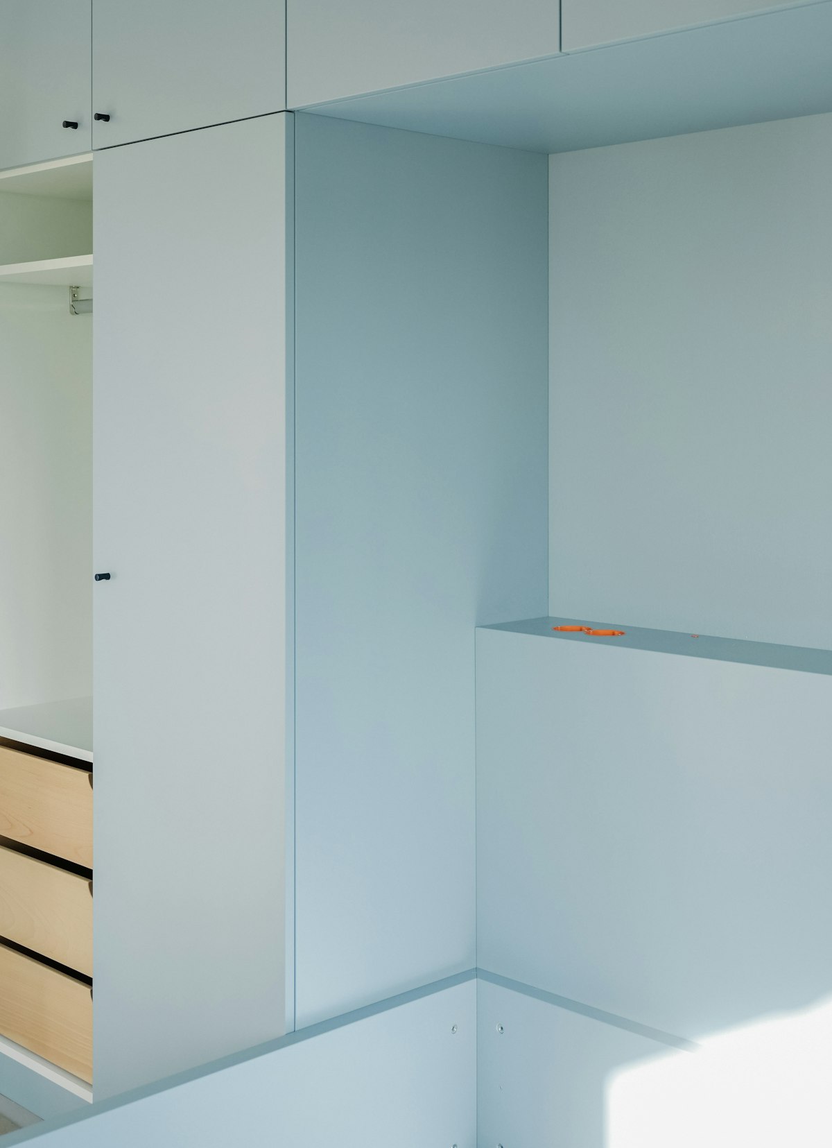 Tidy bedroom with organized wooden drawers