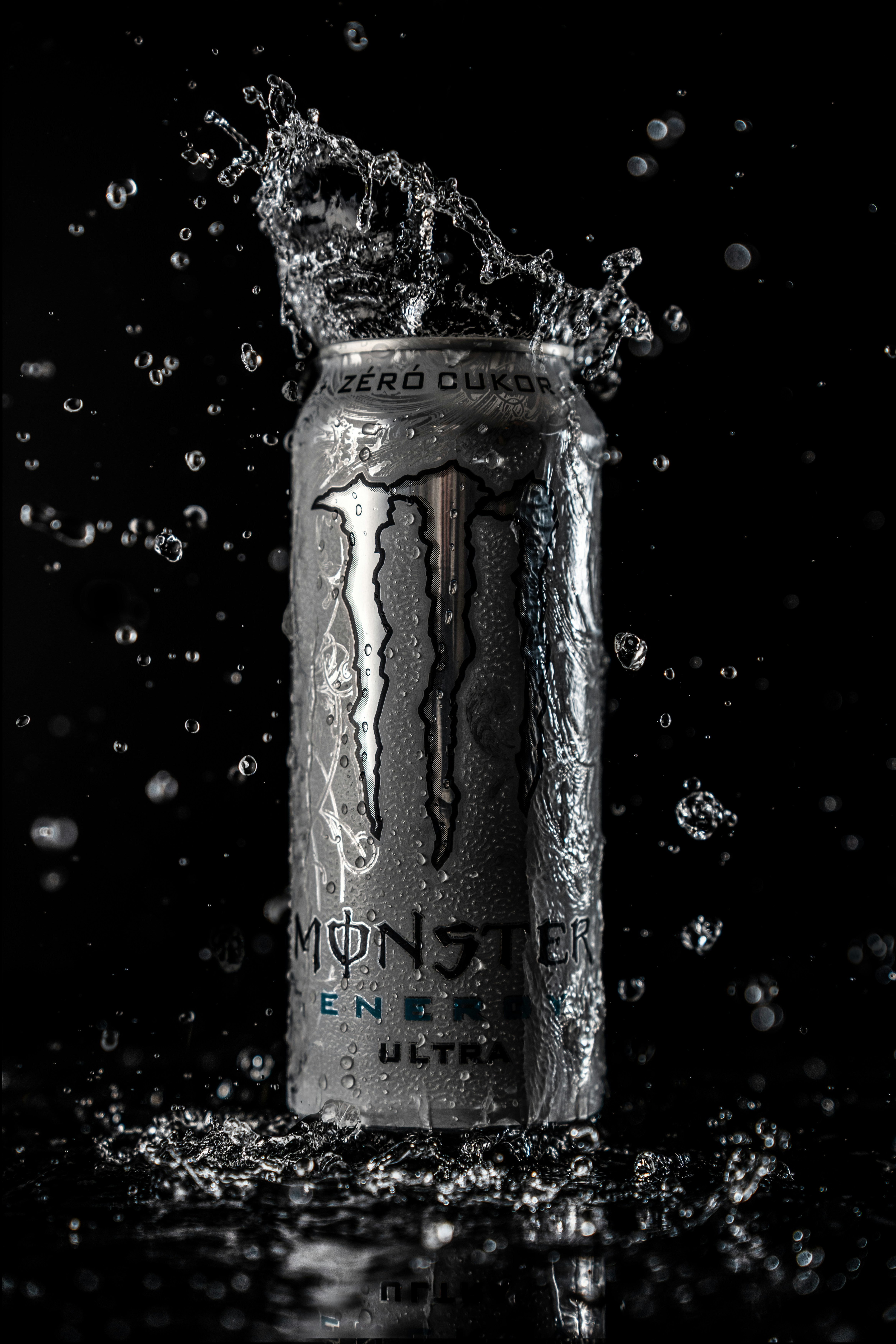 Monster energy ultra can with water splashing