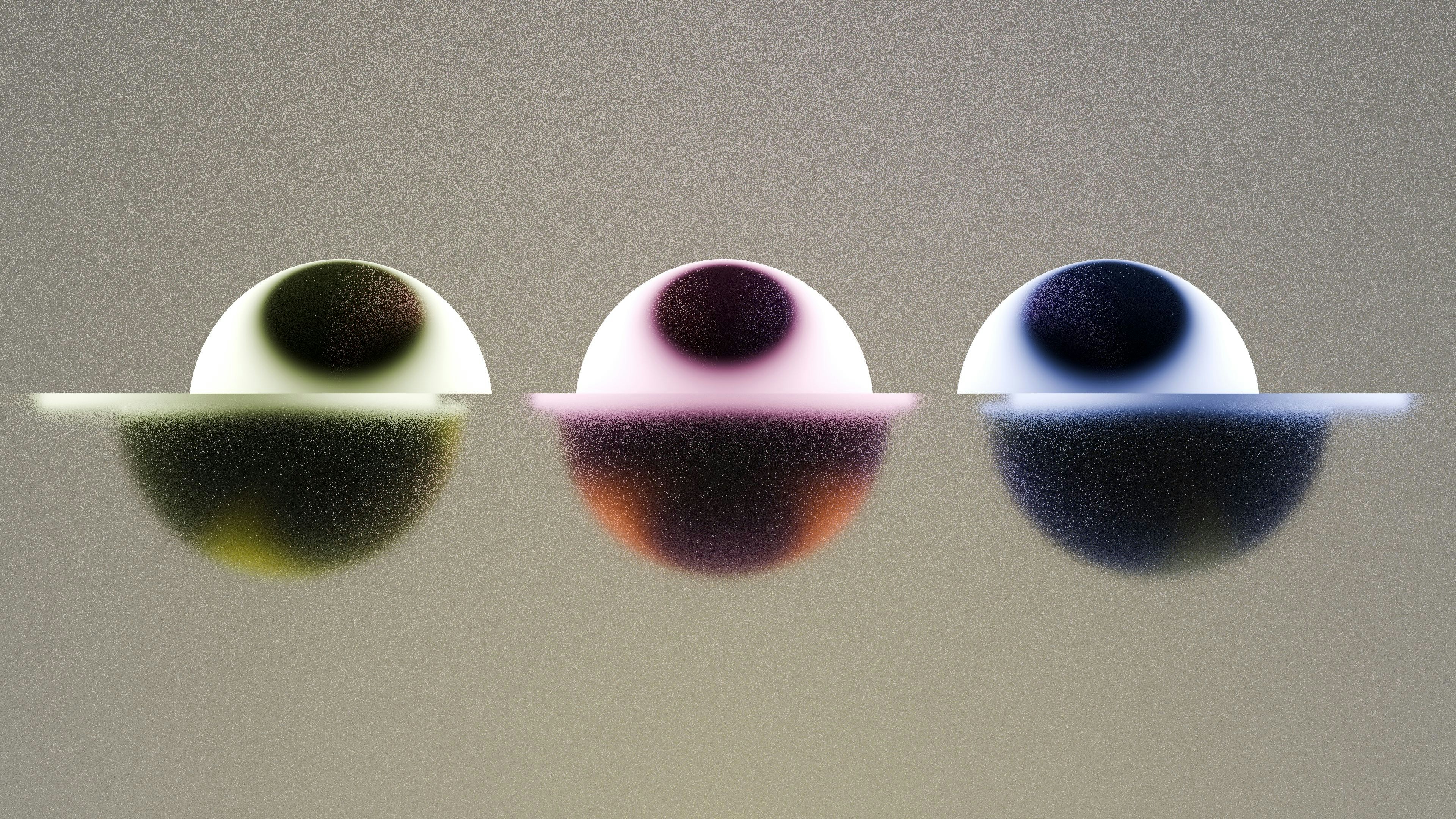 Trois sphères abstraites colorées sur un fond clair