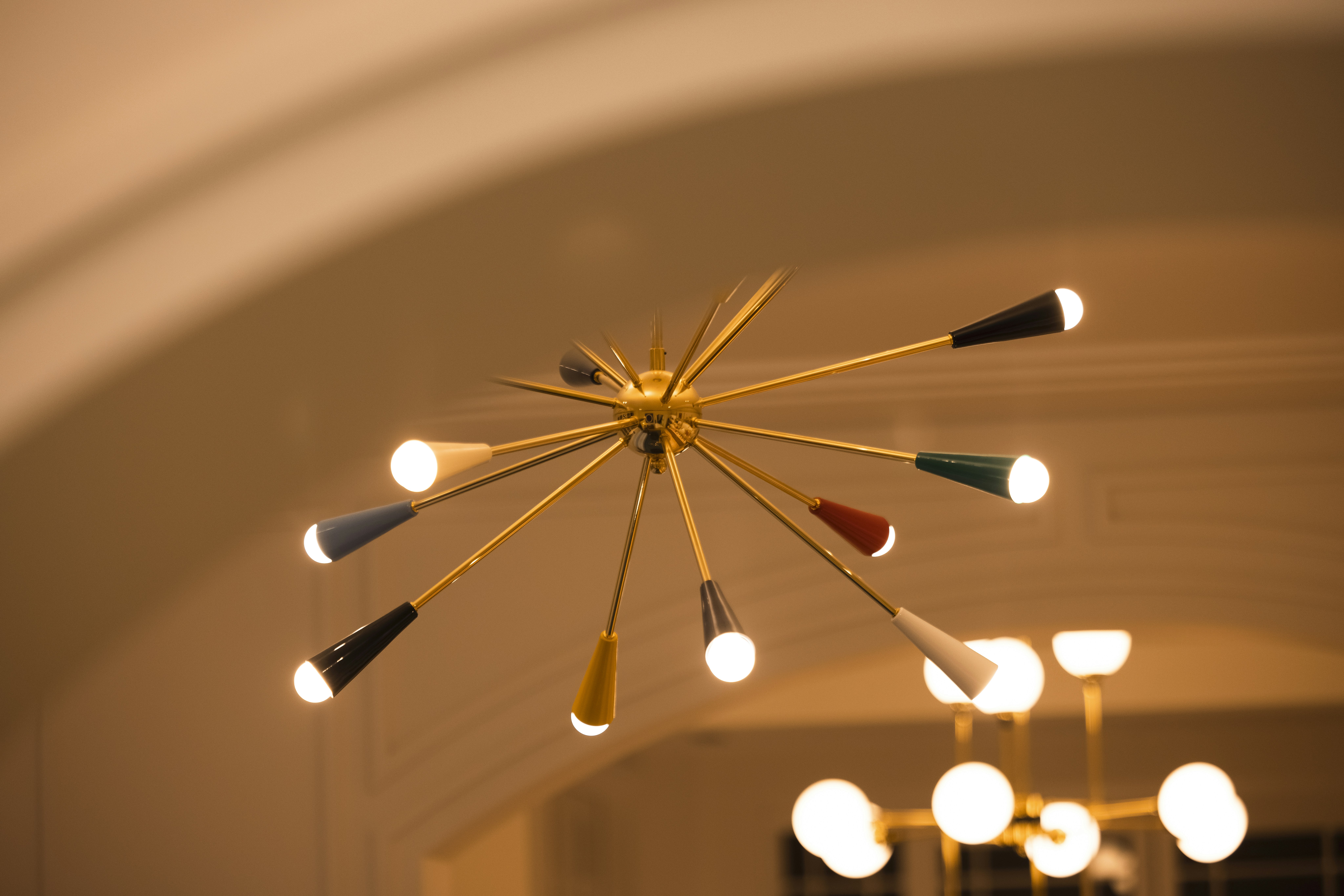 A starburst chandelier with colorful accents.
