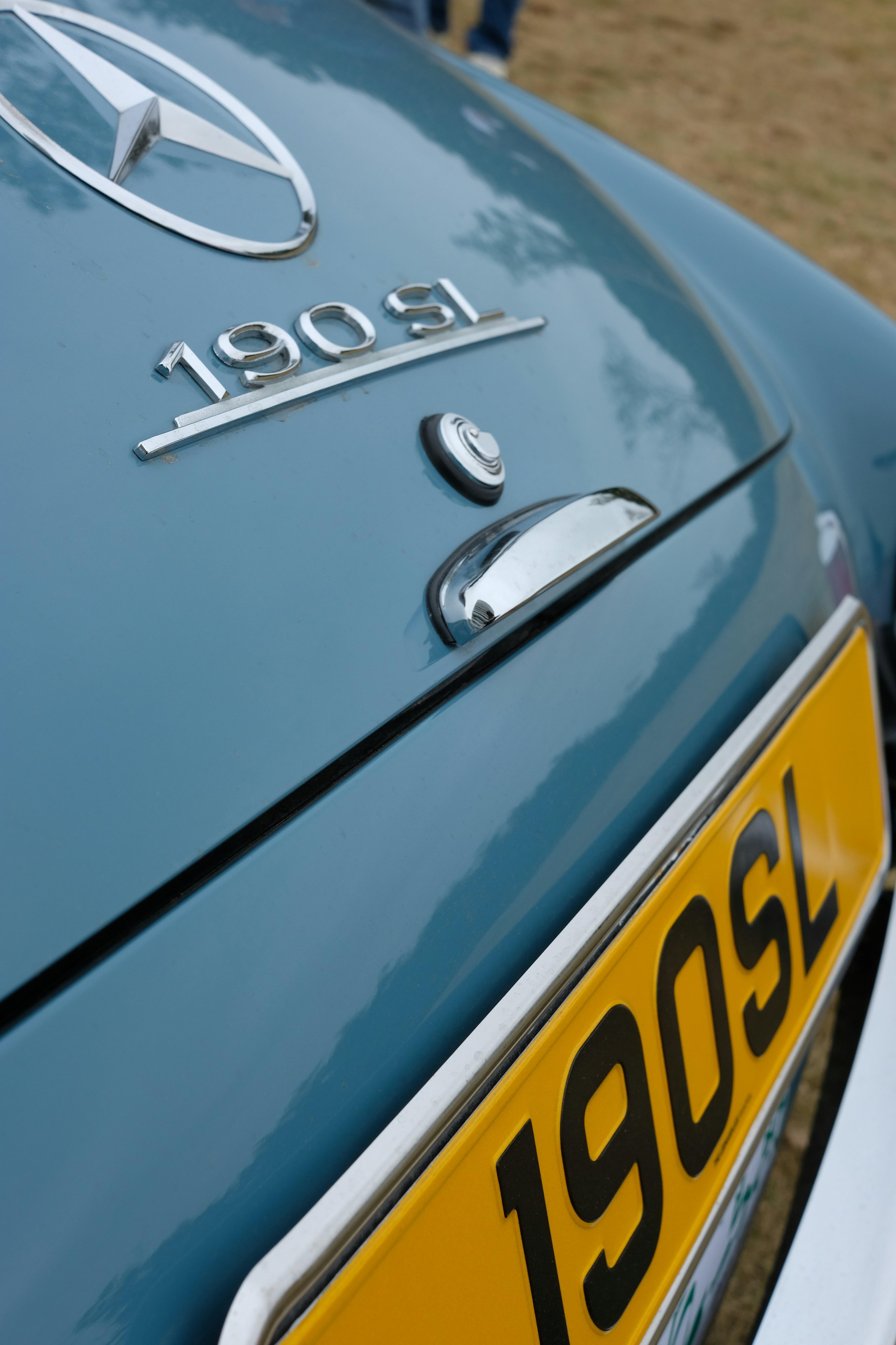 Close-up of a vintage blue mercedes-benz 190sl car