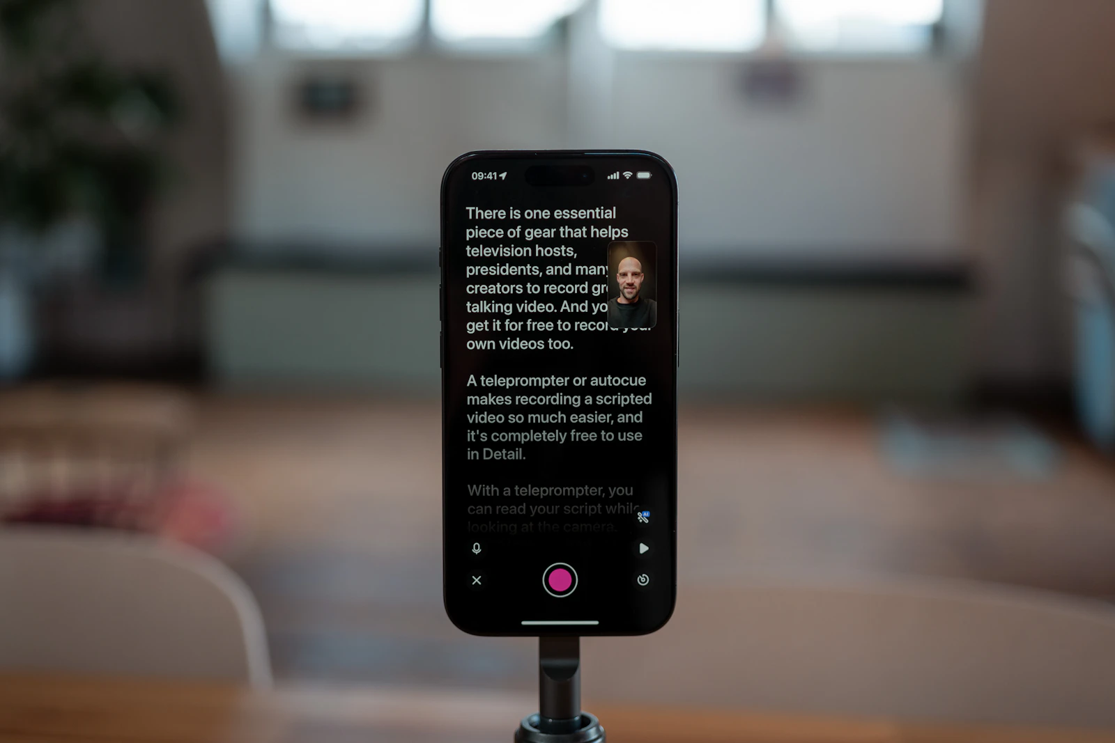 A smartphone on a tripod displaying a creator's script