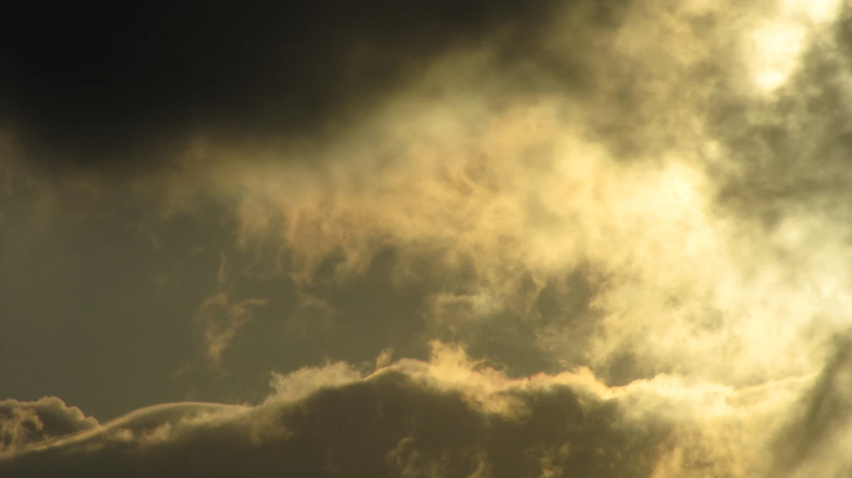 Golden light breaking through dramatic storm clouds