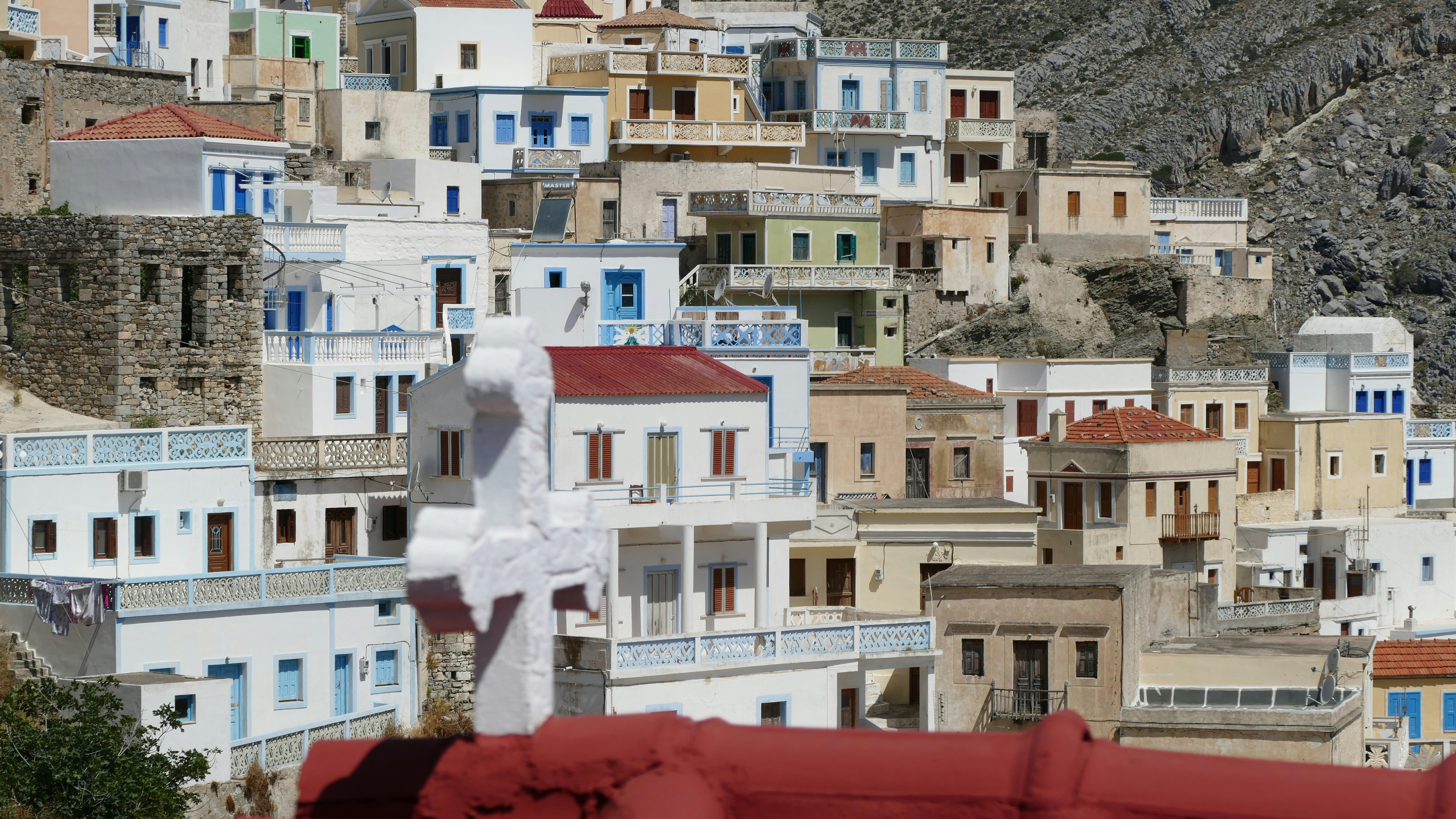 Colorful houses clustered on a hillside.