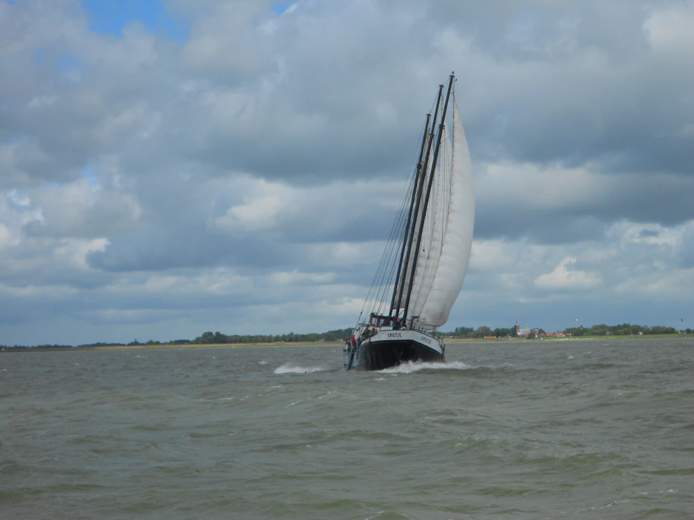 Sailboat on downwind passage across open Pacific waters