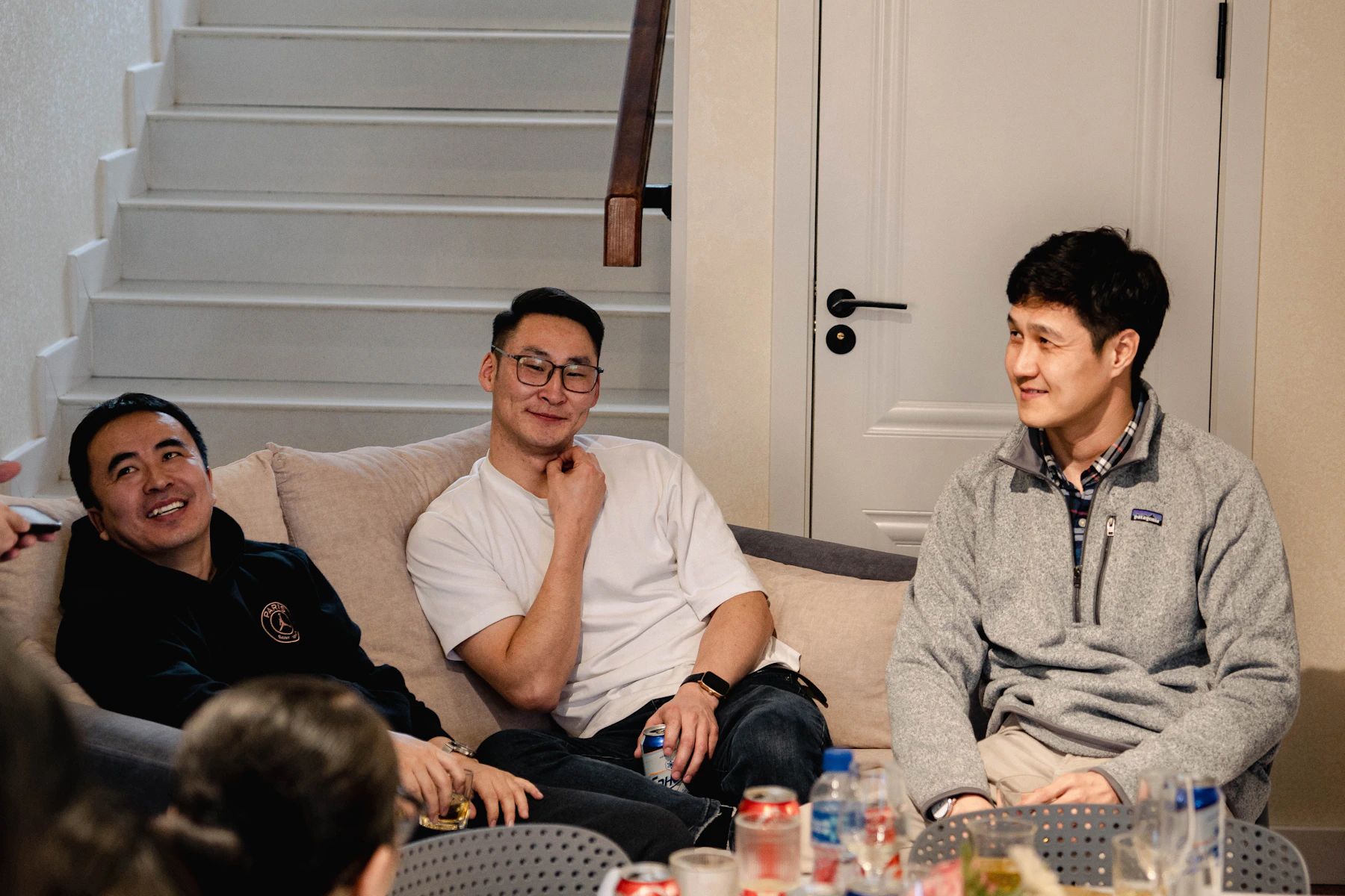 Friends reconnecting through an easy conversation at home