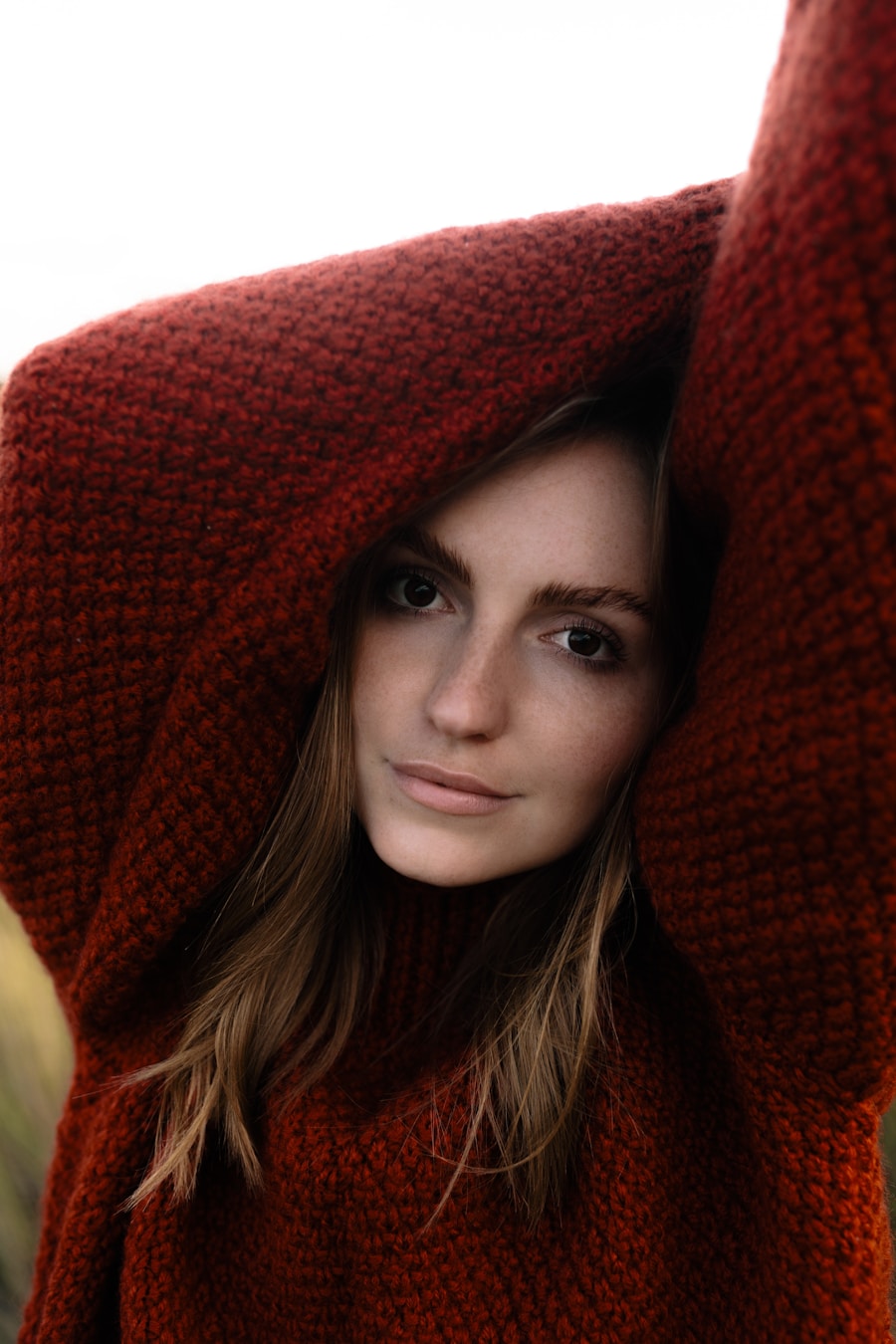Mercer Merino-Silk Sweater Dress in rust — editorial portrait
