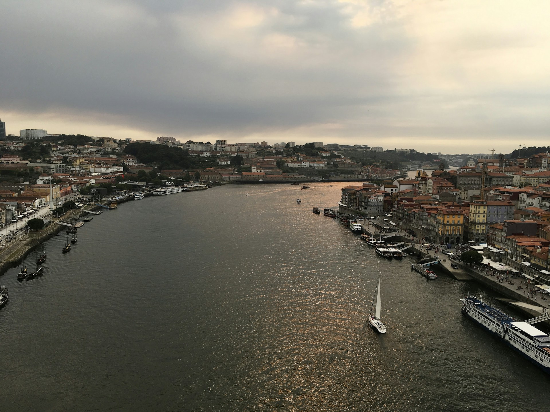 River flowing through a european city at dusk.
