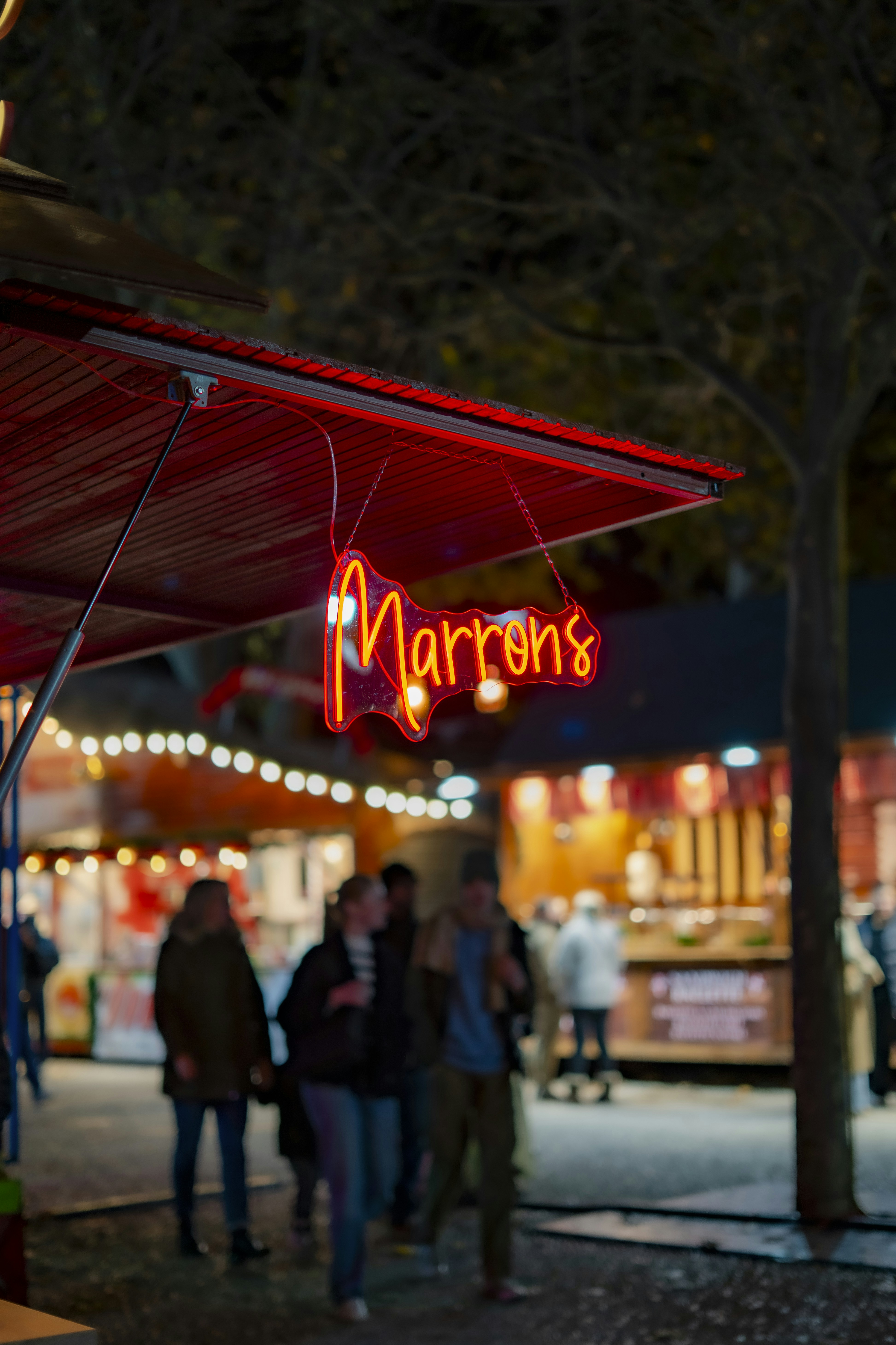 Neon sign for marrons at a night market