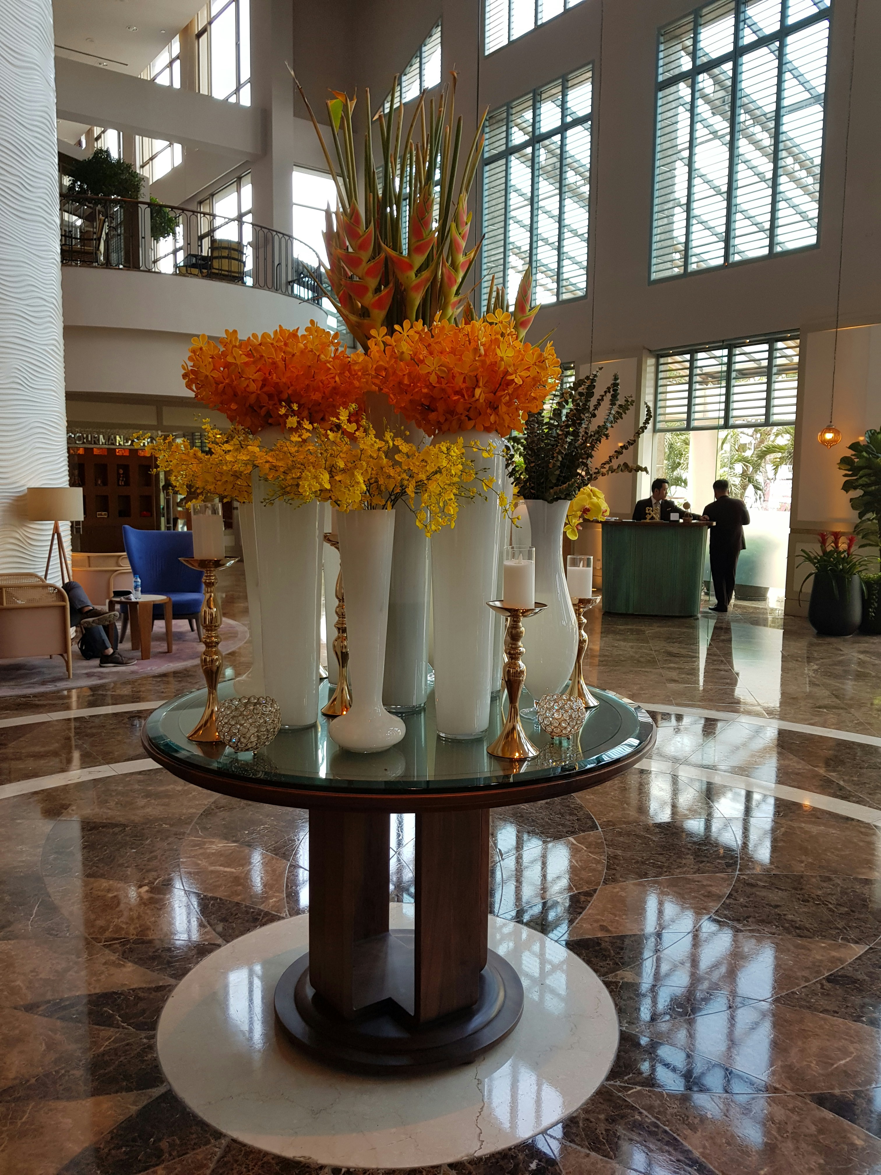 Professional floral arrangement showing balanced flower color combinations in a luxury setting