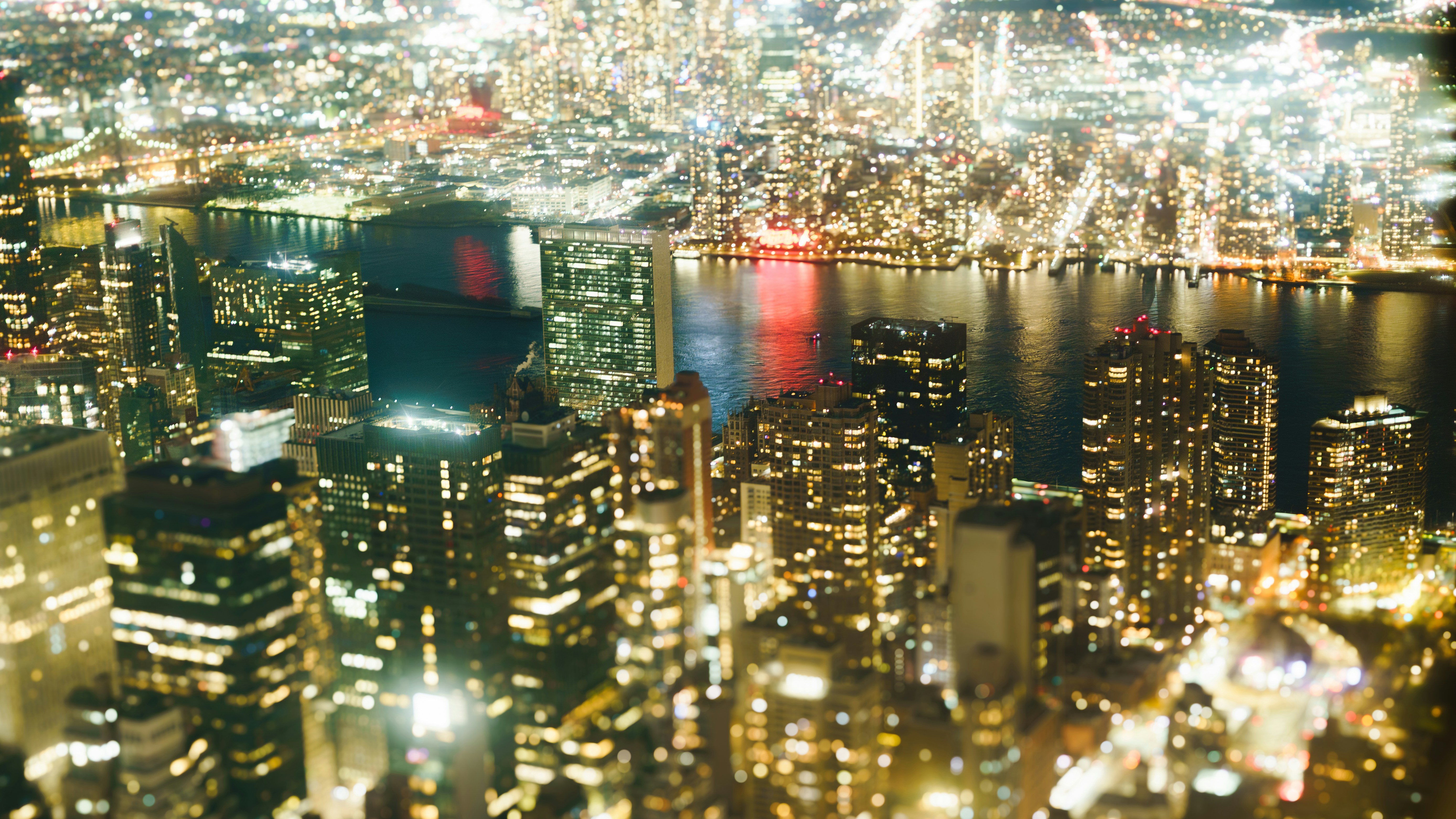 City skyline illuminated at night with reflections