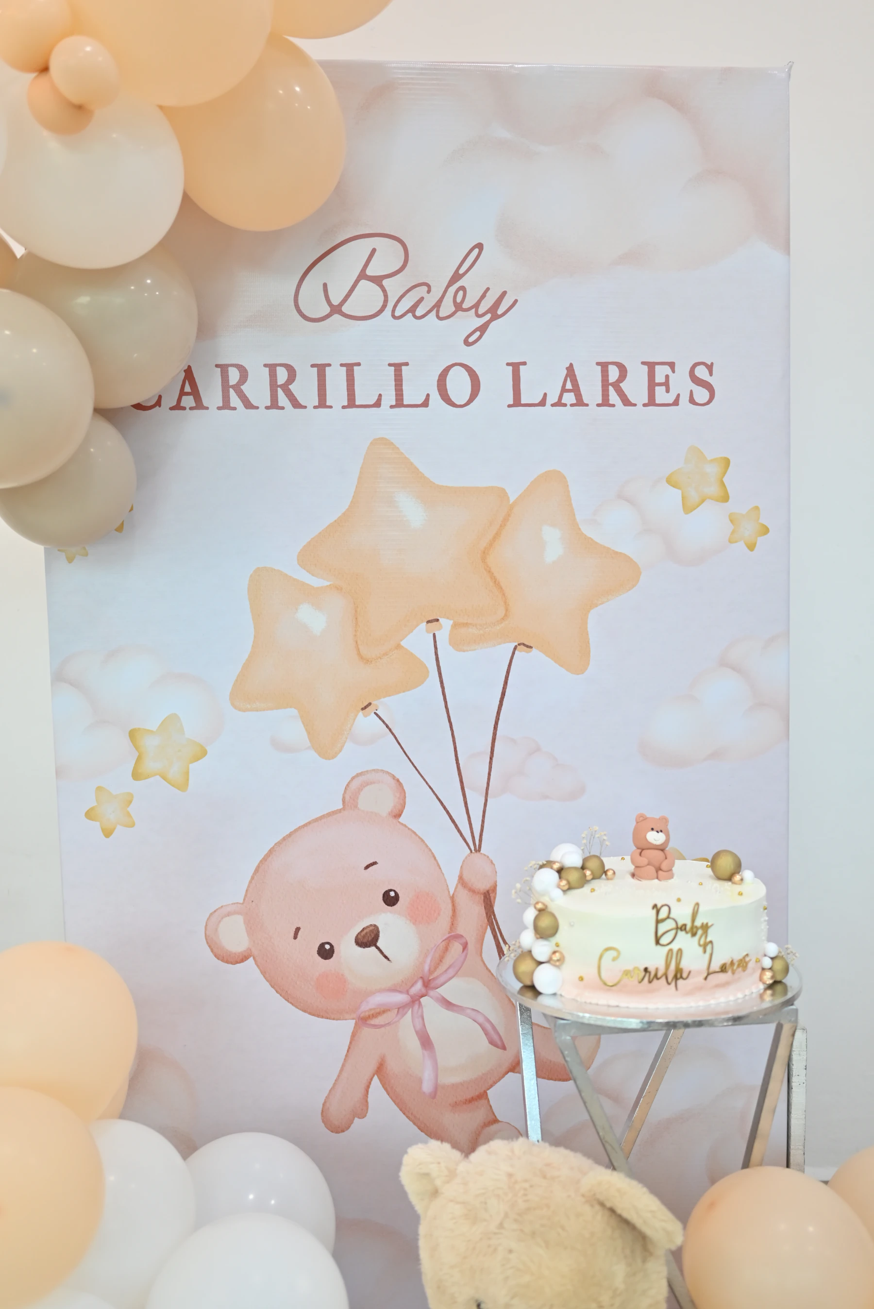 Celebration dessert display with balloons, cake decorations and coordinated party backdrop