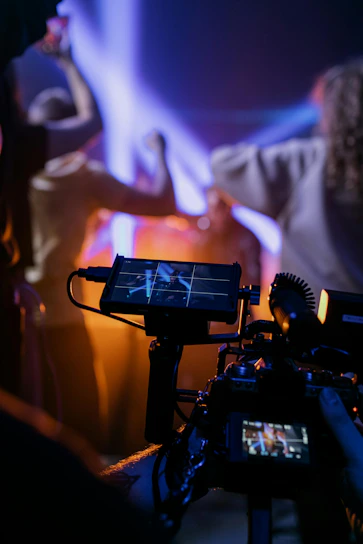 Filming a concert with colorful stage lights