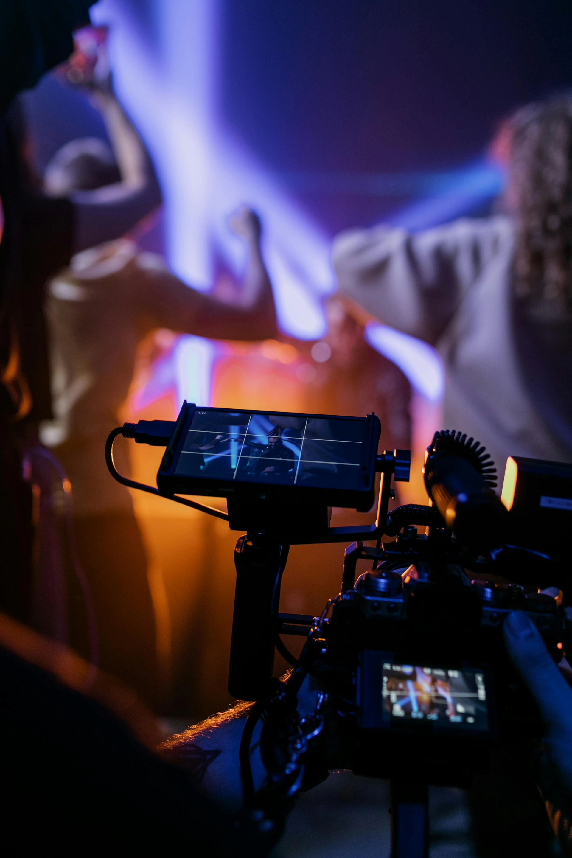 Filming a concert with colorful stage lights