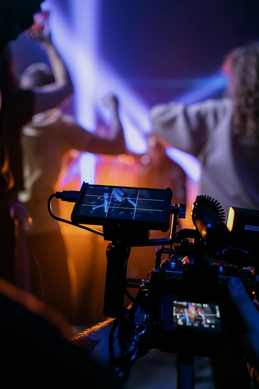Filming a concert with colorful stage lights