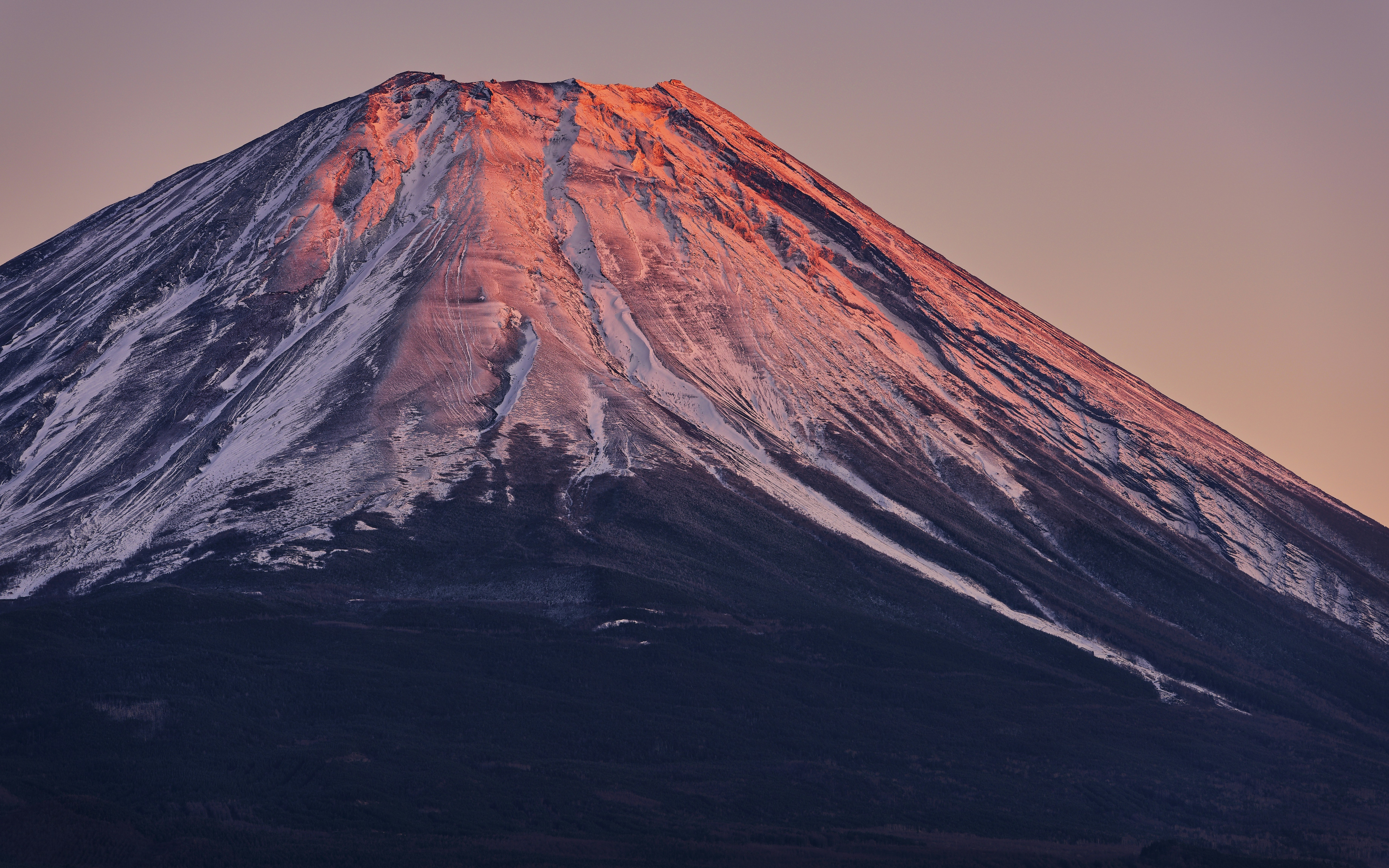 Mount fuji bathed in warm sunrise light