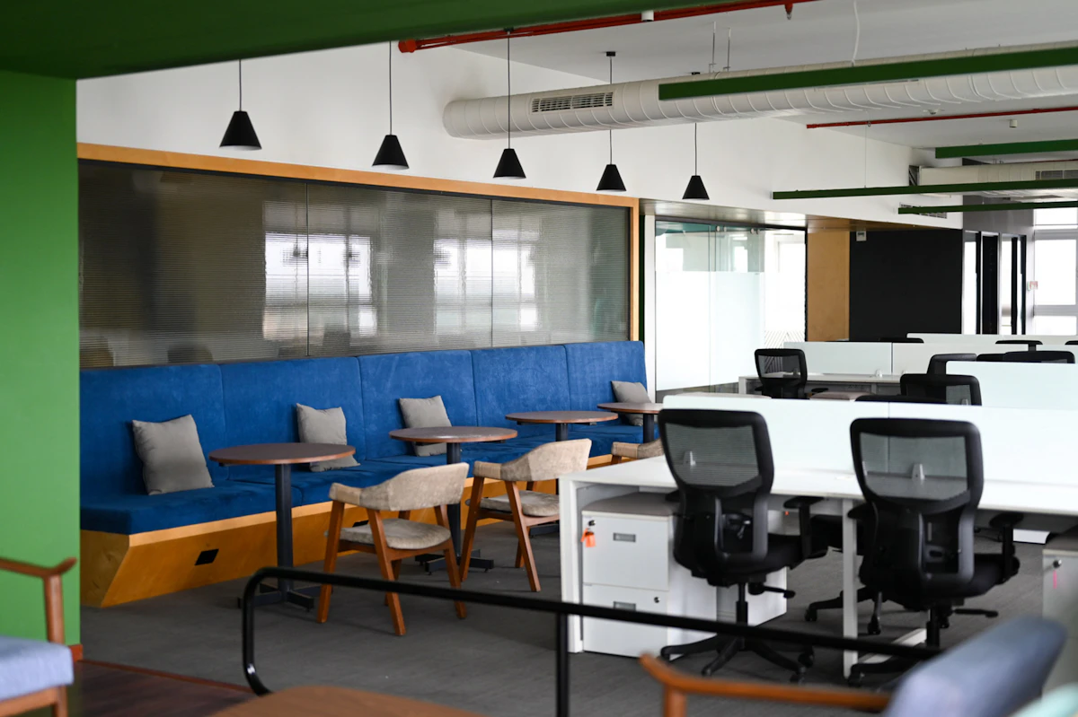 Modern office with blue seating and desks