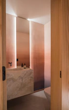 Modern bathroom with marble sink and ombre walls
