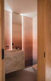 Modern bathroom with marble sink and ombre walls