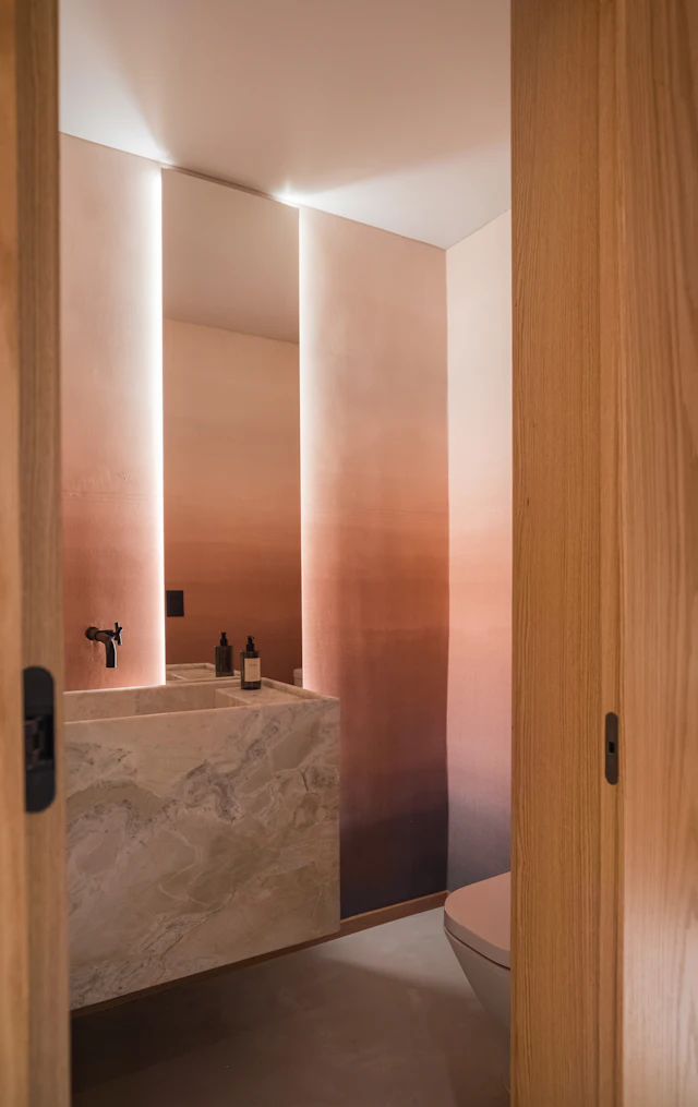 Modern bathroom with marble sink and ombre walls