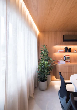 Modern room with wood paneling and large windows.