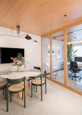 Modern dining area adjacent to office space