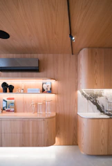 Modern interior with warm wood and marble accents.