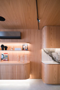 Modern interior with warm wood and marble accents.