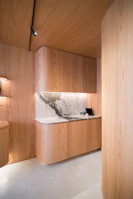 Modern wooden kitchen with marble backsplash