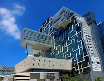 Modern architectural building with geometric patterns on facade.