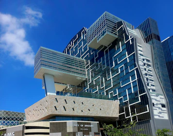 Modern architectural building with geometric patterns on facade.