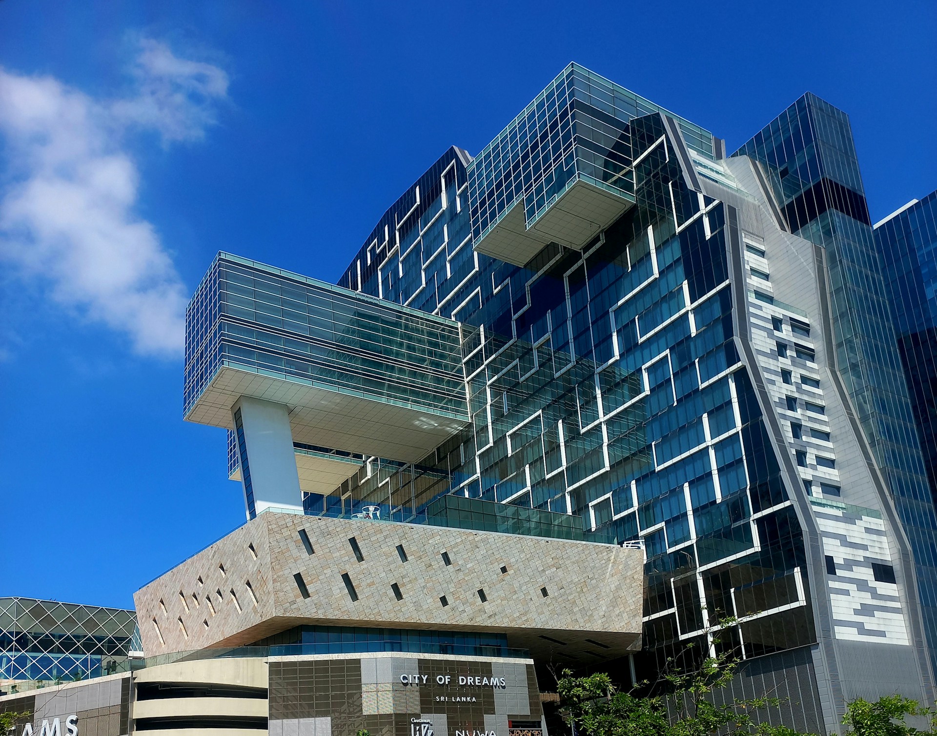 Modern architectural building with geometric patterns on facade.