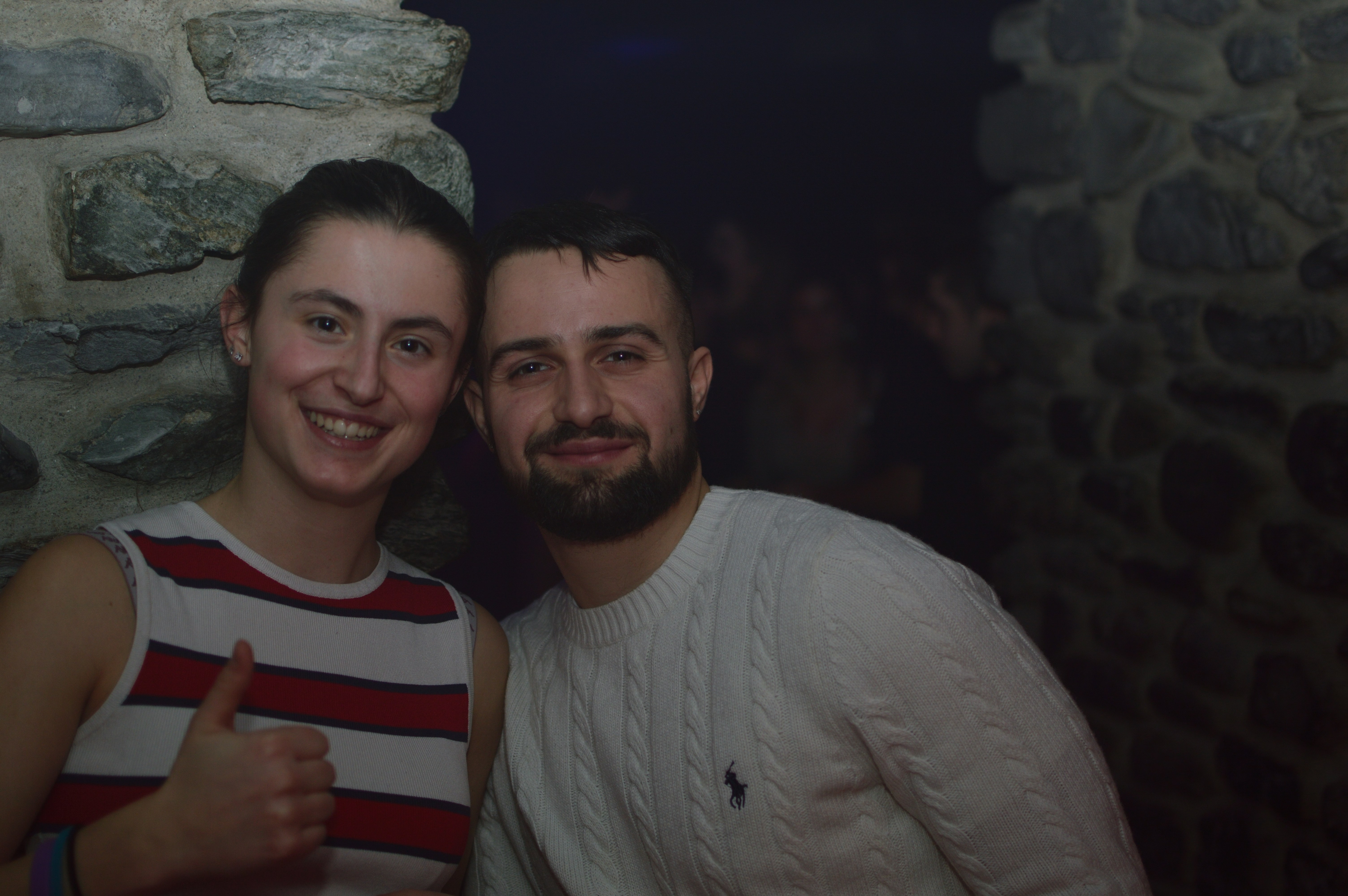 A young woman and man smiling together