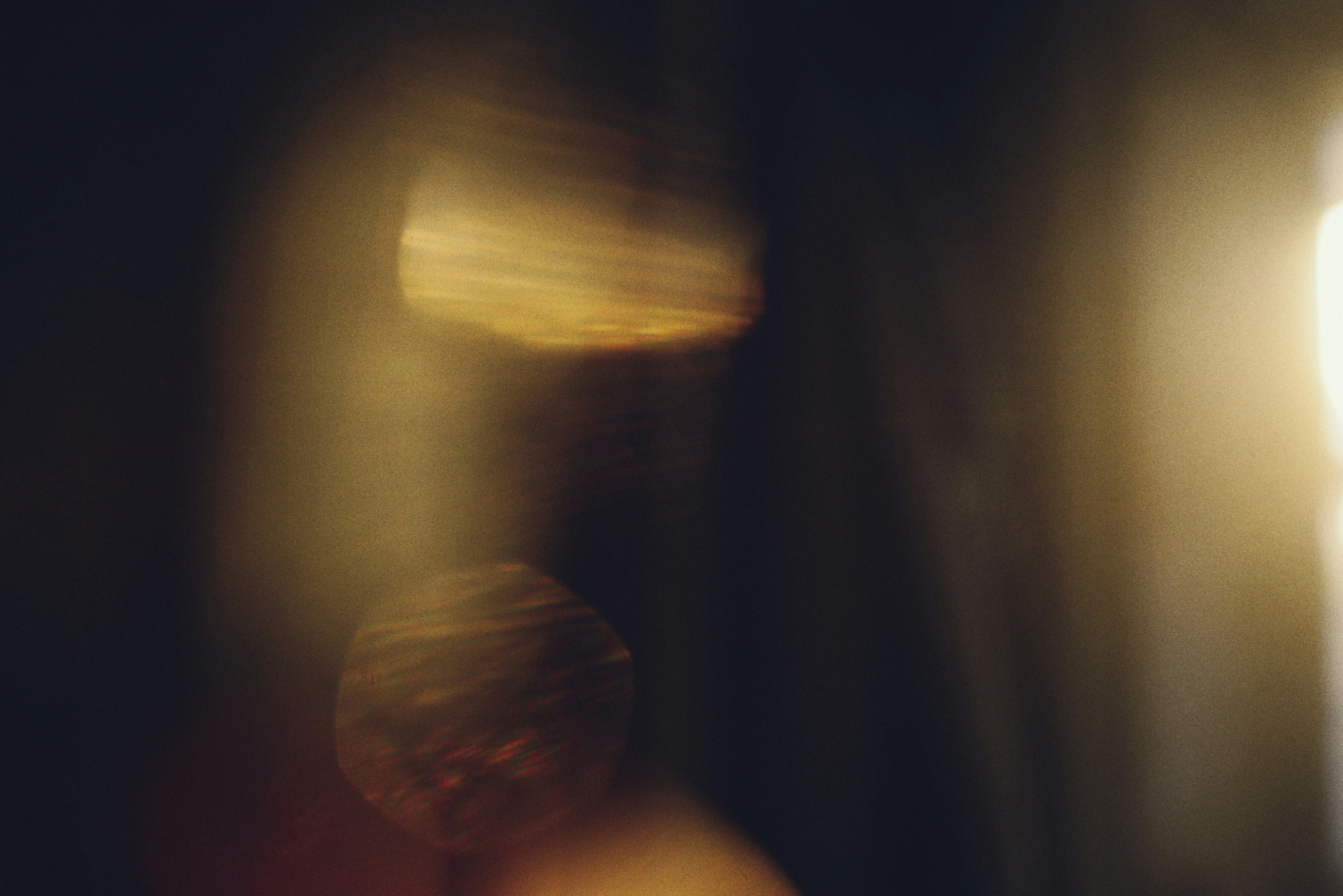 Abstract golden light flares on dark background