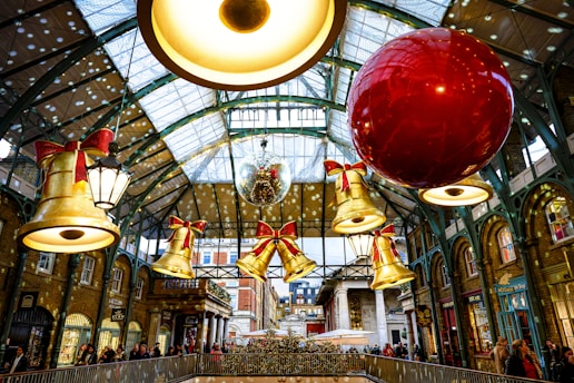 Christmas decorations hanging in a market hall.